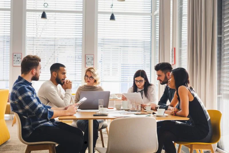 six-persons-sitting-in-meeting-room