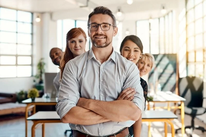 a-group-of-smiling-business-people-in-an-office