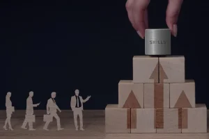 a-person-putting-a-can-on-top-of-a-stack-of-wooden-blocks