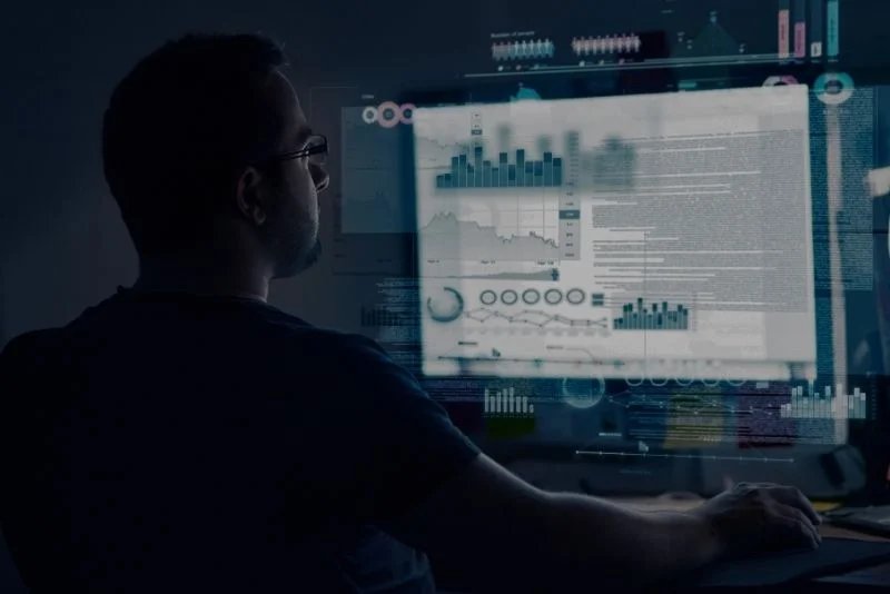 a person is sitting in front of a computer screen